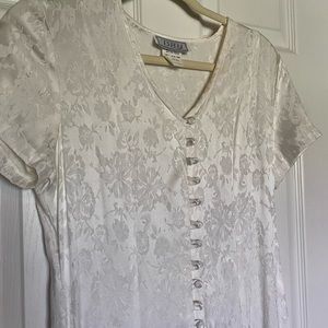 Long white dress with buttons down throughout dress